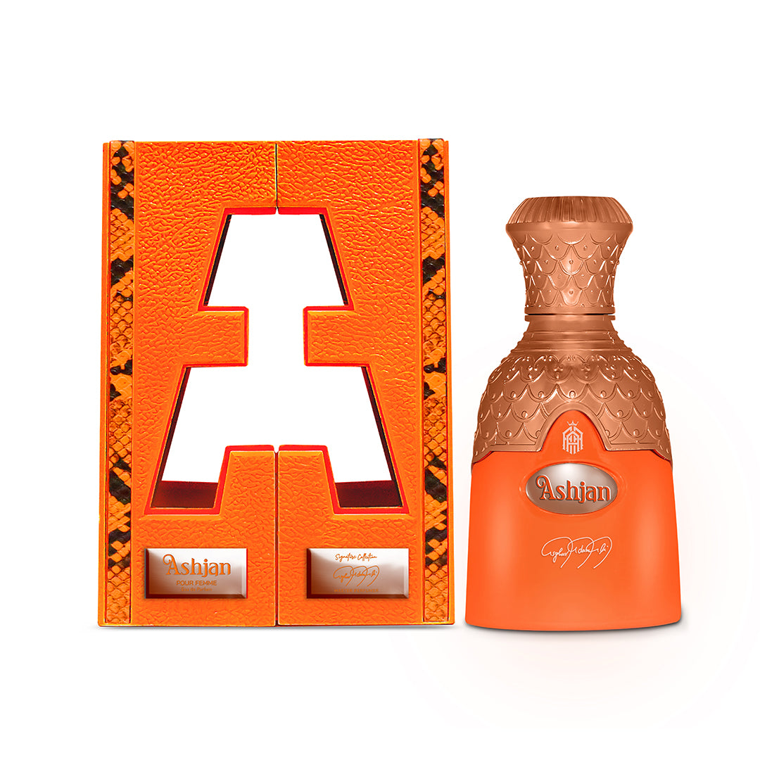 Orange and gold Ashian perfume bottle with matching packaging on a white background