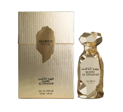 Gold Arabyat Prestige perfume bottle and packaging on a white background