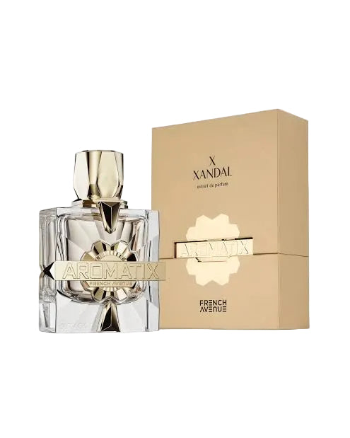 A clear glass perfume bottle with a metallic gold cap and a gold label reading AROMATIX, shown next to its beige packaging box with gold lettering for X XANDAL and FRENCH AVENUE.