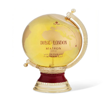 Globular perfume bottle with gold and red design on a white background