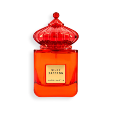 A bottle of Silky Saffron EDP 100ml by Matin Martin with a red cap and label, set against a white background.
