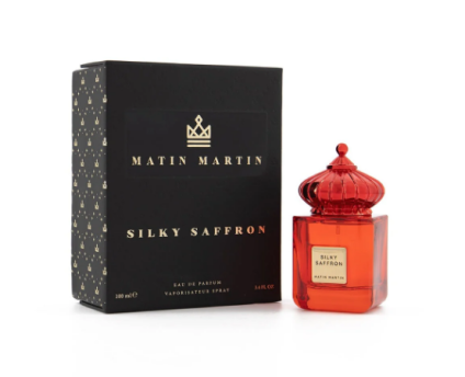 A bottle of Silky Saffron EDP 100ml by Matin Martin with a red cap and label, set against a white background.