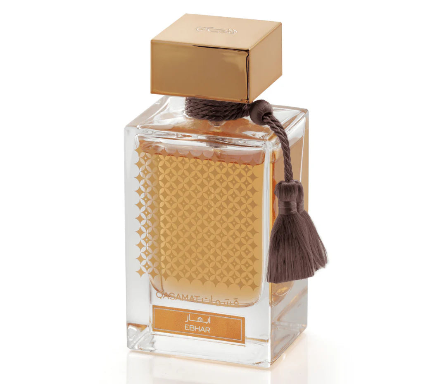 Perfume bottle with gold cap and decorative elements on a white background