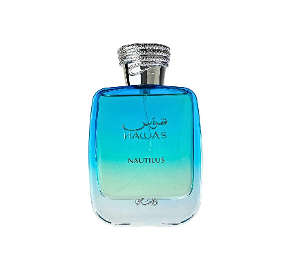 A rectangular glass perfume bottle with a blue-to-turquoise gradient, featuring a textured silver cap and Arabic script with 'HAUAS' and 'NAUTILUS' printed on the front.