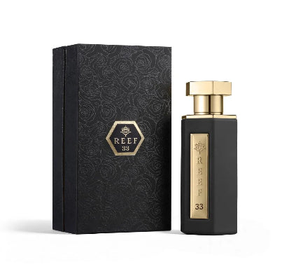 Perfume bottle and packaging with 'REEF 33' branding on a white background
