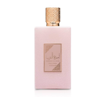 Perfume bottle with pink packaging and gold cap on a white background