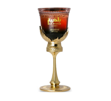 Gold goblet with red and black label on a white background