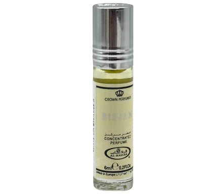 Small perfume bottle with silver cap and white label on a white background