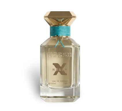 Perfume bottle with gold cap and clear body on a white background
