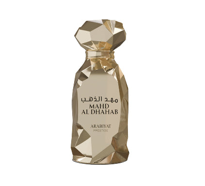 Gold perfume bottle labeled 'Mahd Al Dhabab' by Arabiyat on a white background