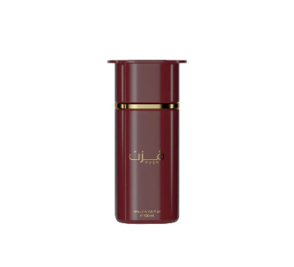 Red perfume bottle with gold accents on a white background