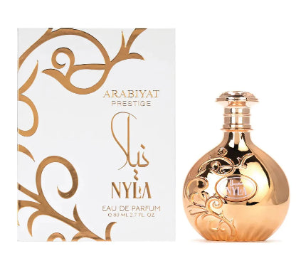 Gold perfume bottle and packaging with 'Nyla' branding on a white background