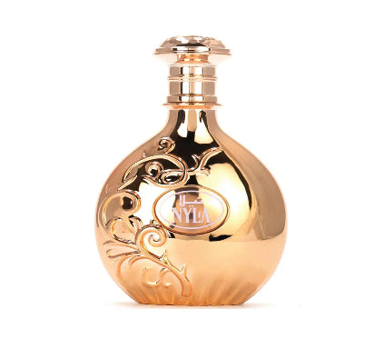 Gold perfume bottle with intricate designs on a white background